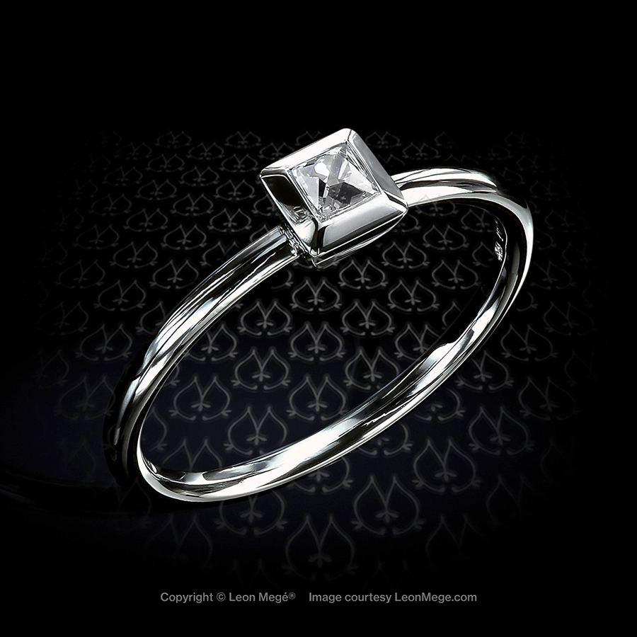 Leon Megé platinum solitaire with a French cut diamond in a bezel setting on a uniform shank r6033