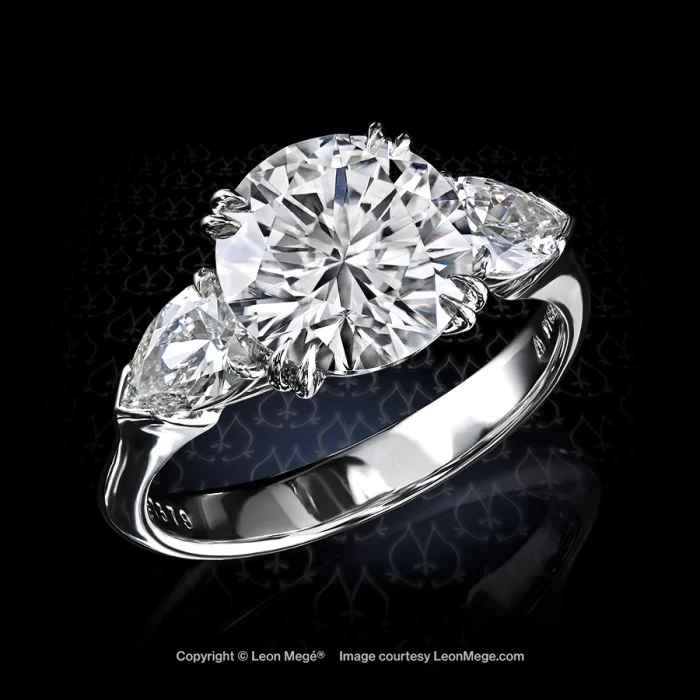 Classic three-stone ring fearing round cut diamond and pear-shape diamonds r7379 by Leon Mege