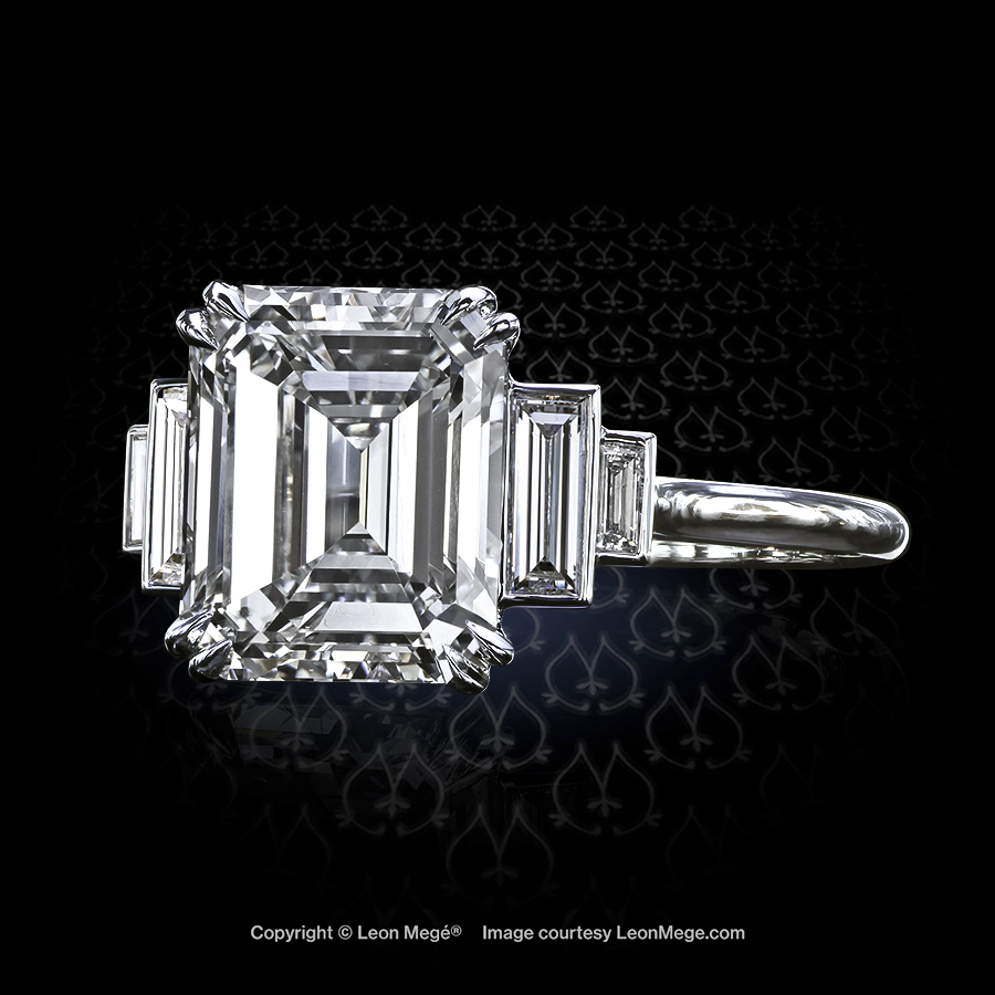 Custom made five-stone ring featuring an emerald cut diamond by Leon Mege.
