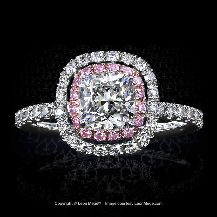 Custom double halo engagement ring featuring cushion cut diamond with natural pink diamonds in rose gold and platinum by Leon Mege.
