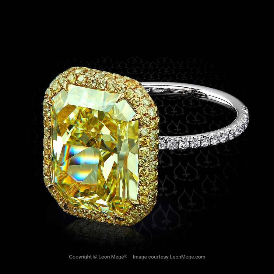 Custom micro pave ring with vivid yellow radiant cut diamond set in gold and platinum by Leon Mege.