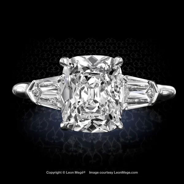 Bespoke Leon Megé three-stone ring with a delicious True Antique™ cushion diamond and diamond shields r7176