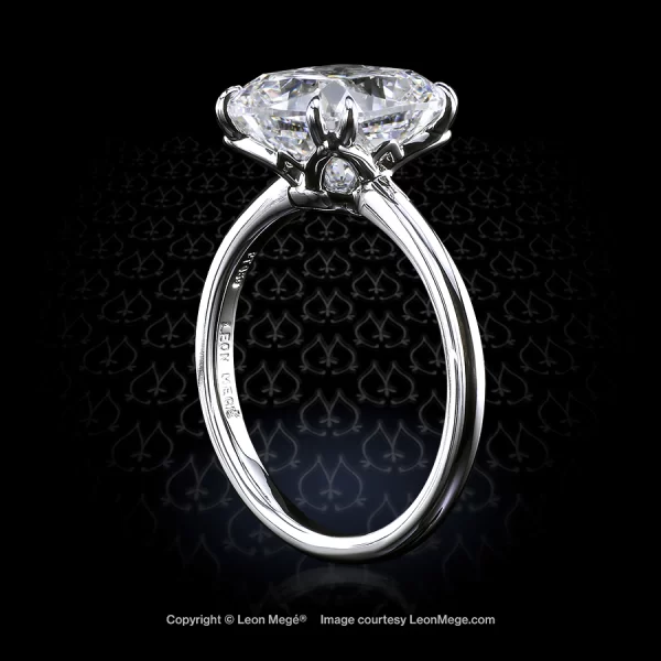Leon Megé elegant engagement solitaire with a modern cushion diamond in double claw prongs r7397