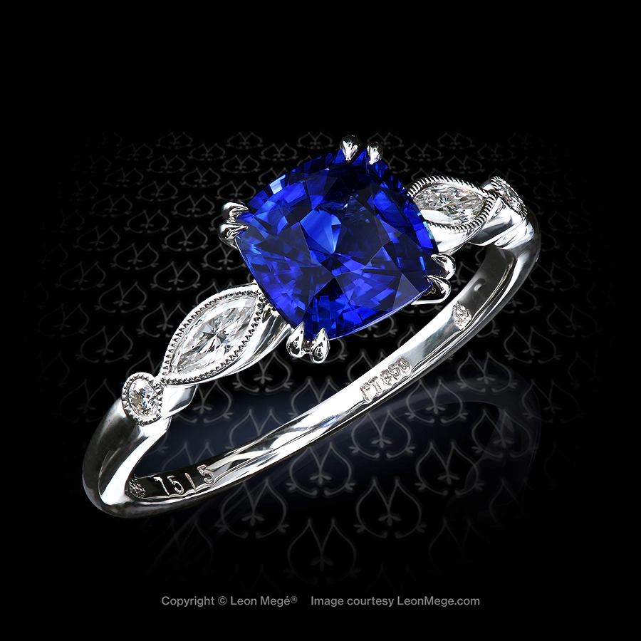 Custom made ring with beautiful blue cushion sapphire uncertified but with amazing shade of royal blue set with marquise diamonds by Leon Mege