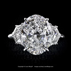 Three-stone ring featuring over 5.5 ct oval diamond and epaulette diamonds by Leon Megé r7445