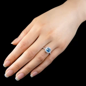 Leon Megé exclusive "Lotus" ring with a "Montana-blue" Asscher-cut sapphire in a diamond halo r7381