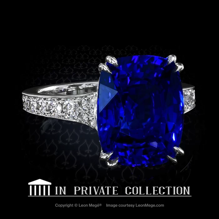 Natural cushion cut blue sapphire in a diamond pave ring by Leon Mege
