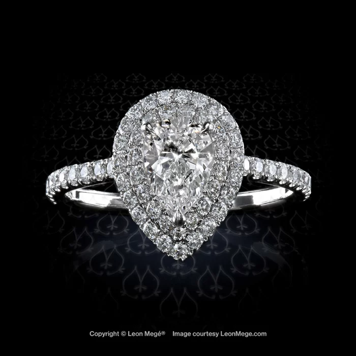 Galaxy halo ring featuring a pear shape diamond by Leon Mege.