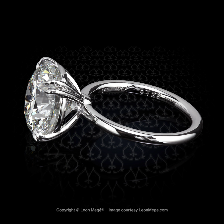 Modern hand forged custom made solitaire featuring a round diamond by Leon Mege r5726
