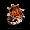 Honey Tourmaline in a pink gold ring with white and red diamonds micro pave by Leon Mege.