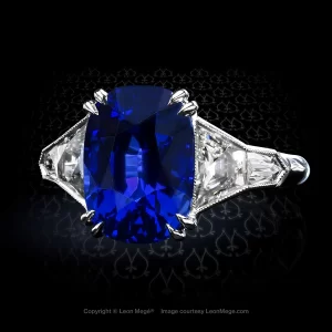 Five-stone ring featuring a natural 5.06 carat cushion blue Burma sapphire set with French cut diamonds by Leon Mege