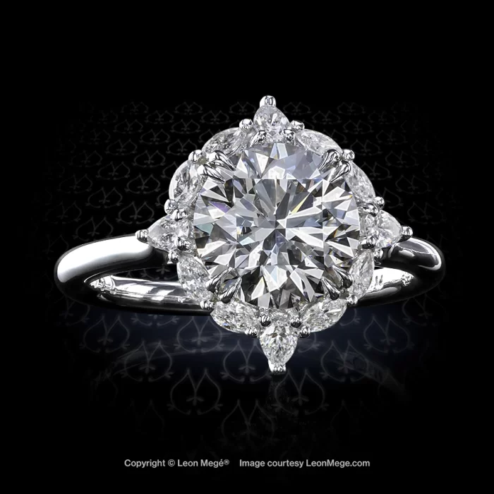 Custom made bespoke diamond engagement ring with a round brilliant and pear shapes and marquises cluster by Leon Mege