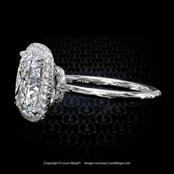 Stunning modern cushion diamond set in a micro pave halo with a thin shank by New York jeweler Leon Mege