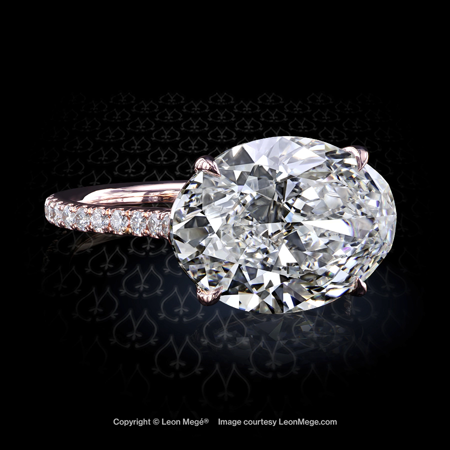 Leon Megé East-West two-tone solitaire with a massive oval diamond on a thin micro-pave shank r7443