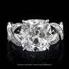 Solitaire ring with 6.63 carat True Antique cushion diamond and French cut diamonds by Leon Mege.