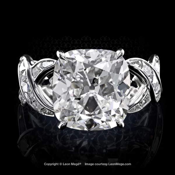 Solitaire ring with 6.63 carat True Antique cushion diamond and French cut diamonds by Leon Mege.