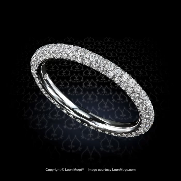 Diamond wedding band with three rows of micro pave by Leon Mege.