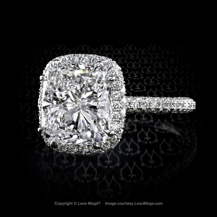 Halo ring with 4.55 carat cushion diamond and micro pave handmade by Leon Mege.