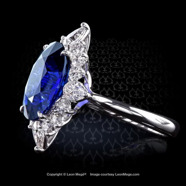 Custom made "Rose of the Winds" cluster ring with 7.02 carat oval blue sapphire by Leon Mege.