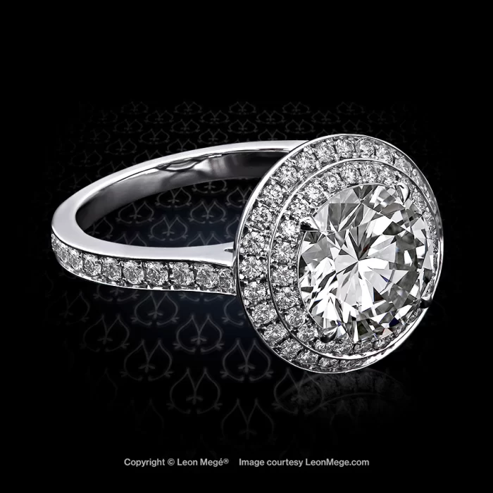 Double halo "Saturn" ring featuring a round diamond in bespoke platinum by Leon Mege