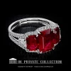 Custom made three-stone ring featuring a natural emerald cut rubies by Leon Mege