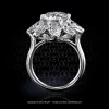 Round diamond in a clusre ring with pear shape diamonds made in platinum by hand by Leon Mege