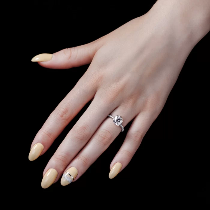 Lotus solitaire featuring a true antique cushion cut moissanite by Leon Mege.