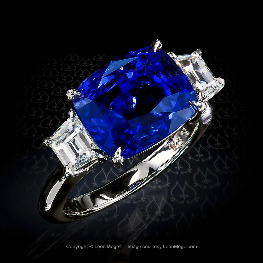 East-west three stone ring with cushion sapphire and trapezoid diamonds in platinum by Leon Mege