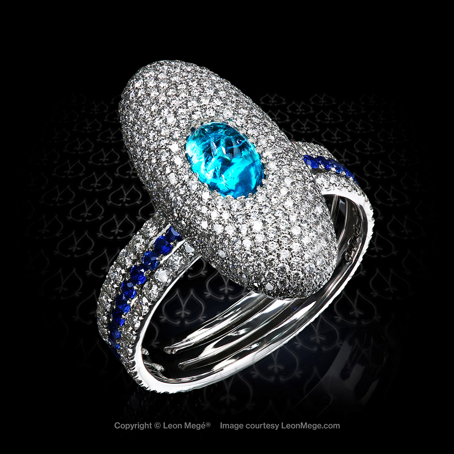 Brazilian Paraiba cab in a micro pave ring with blue sapphires on a triple string shank by Leon Mege