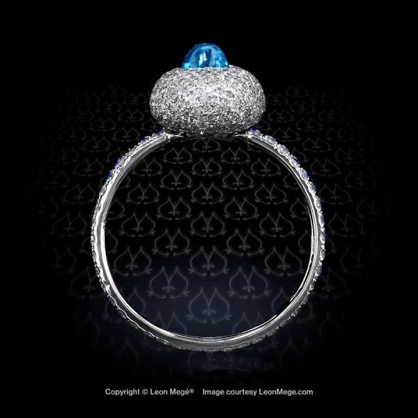 Leon Megé Brazilian Paraiba cab in a right-hand ring with sapphires on a micro pave shank r7777