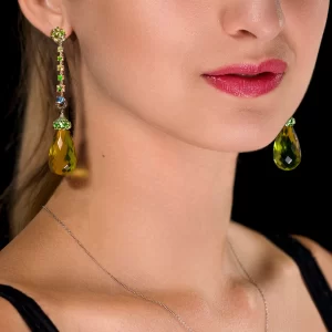 Long drop designer earrings with green amber tsavorite garnets, demantoid garnets and moonstones by Maestro Leon Mege