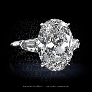 Leon Megé three-stone ring with an oval center stone flanked by step-cut diamond bullets r7806