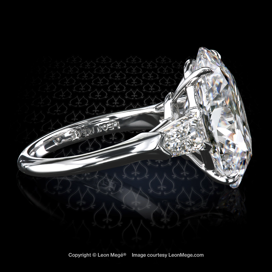 Leon Megé three-stone ring with an oval center stone flanked by step-cut diamond bullets r7806