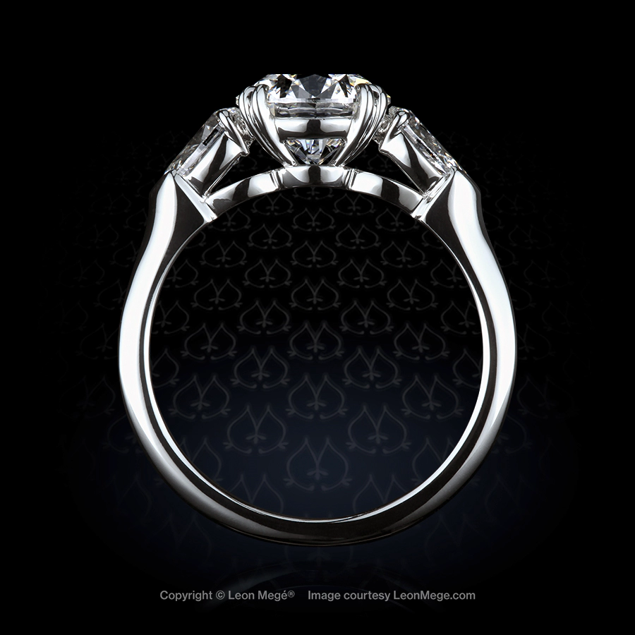 Classic three-stone ring, featuring 1.72 carat round diamond by Leon Mege