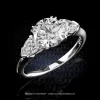 Leon Megé classic three-stone ring with a round diamond and pear-shape side stones set in platinum r7630