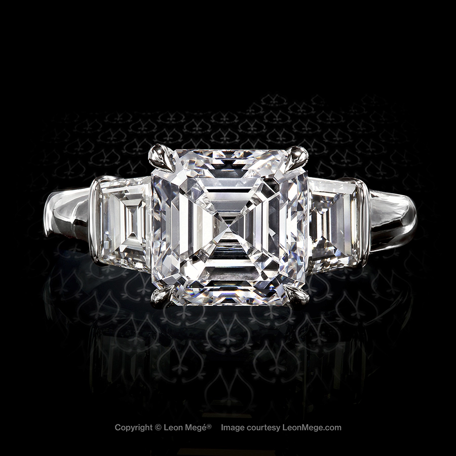 Classic three-stone ring featuring an Asscher cut diamond by Leon Mege.