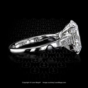 Classic three-stone ring with 2.5 carat oval diamond and diamond tapered baguettes in platinum by Leon Mege