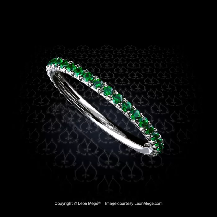 Thin eternity wedding stackable micro pave band in platinum with natural vivid green tsavorite garnets handmade by Leon Mege
