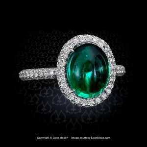 Micro pave halo ring with 4 carat cabochon emerald in platinum by Leon Mege