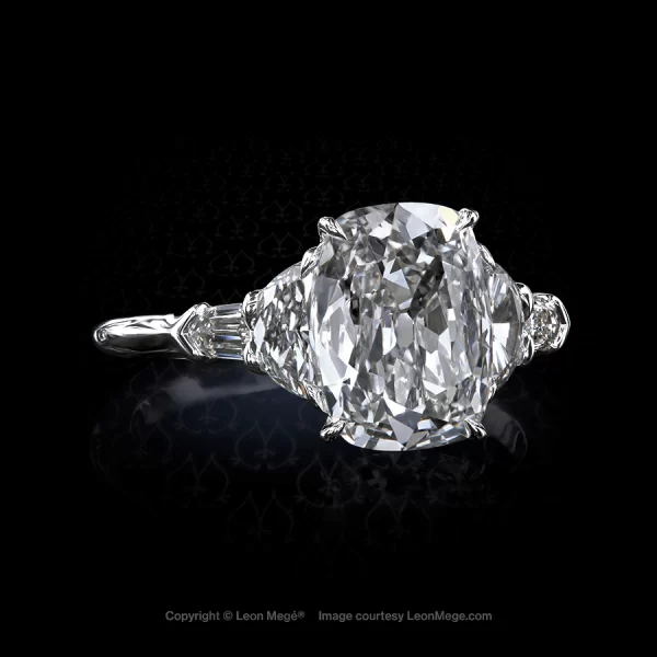 Classic five-stone ring, featuring 3.05 carat true antique™ cushion diamond by Leon Mege