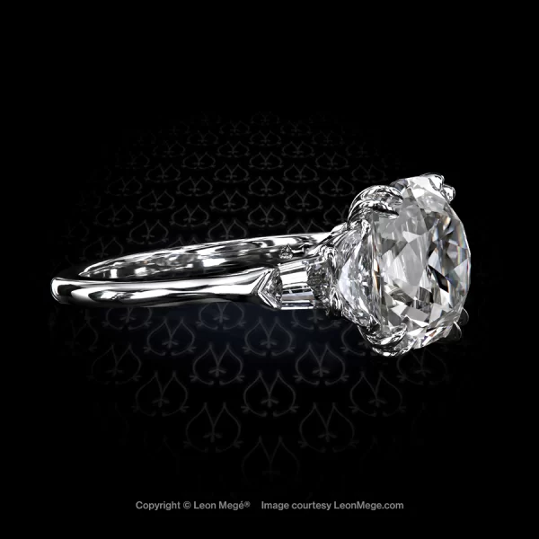 Classic five-stone ring with true antique cushion diamond half moon diamonds diamond bullets in handmade platinum mounting by Leon Mege