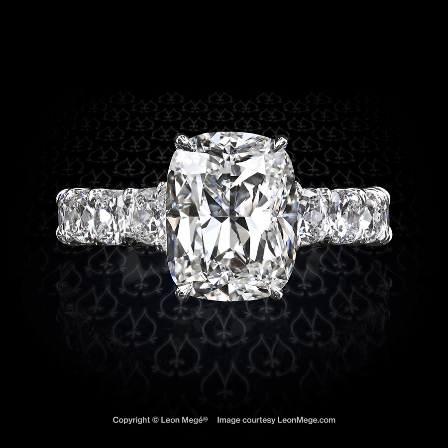 Custom made engagement ring, featuring 5.19 carat antique cushion diamond and 10 smaller antique cushion diamonds on the shank handmade by Leon Mege