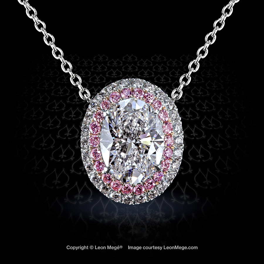 Custom made halo pendant, featuring 1.70 carat oval diamond in a double pink diamond micro pave halo by Leon