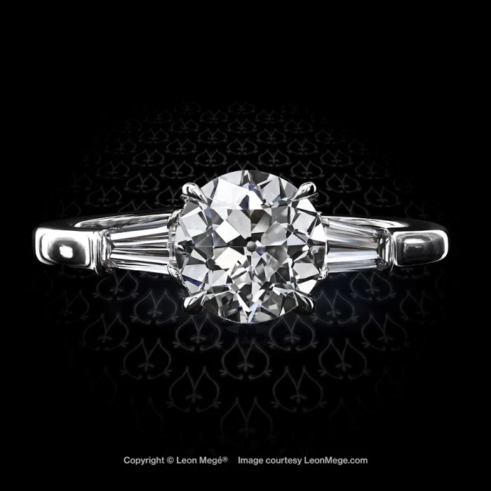 Classic three-stone ring in platinum with 1.51-carat old european cut round diamond by Leon Mege jewelers