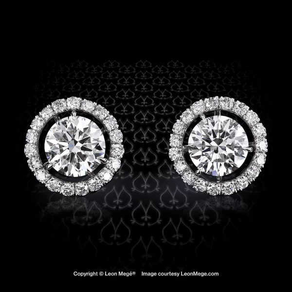 “Martini” three-prong diamond studs with removable micro pave jackets in platinum by Leon Mege.