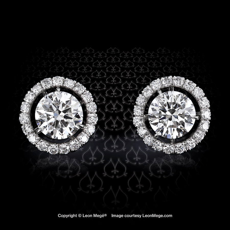 “Martini” three-prong diamond studs with removable micro pave jackets in platinum by Leon Mege.