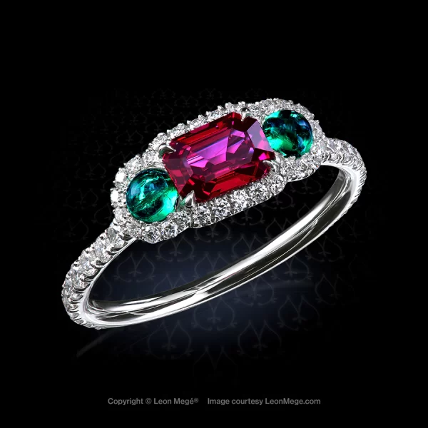 Three-stone “Monpassier” with ruby and cabochon emeralds surrounded by diamond micro pave by Leon Mege.