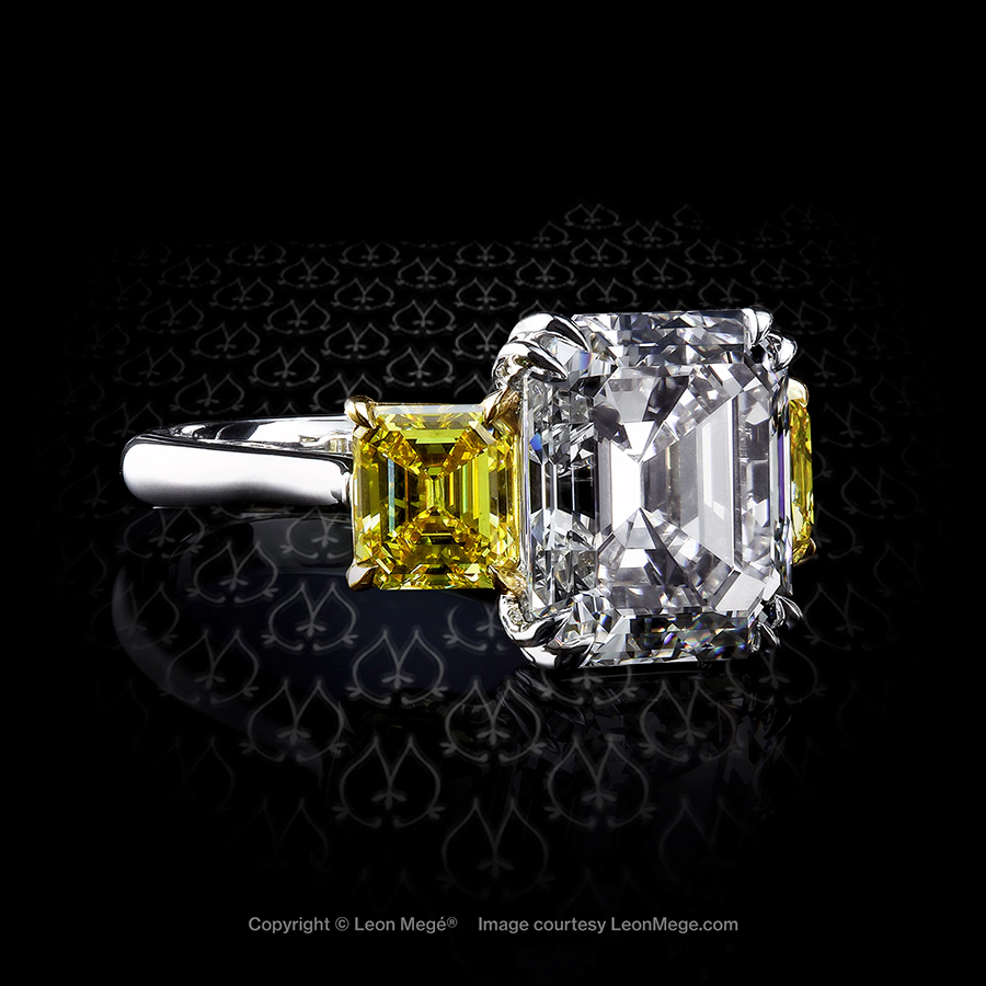 Three stone ring with an elongated Asscher cut diamond and fancy yellow Asscher cut diamonds on the side by Leon Mege
