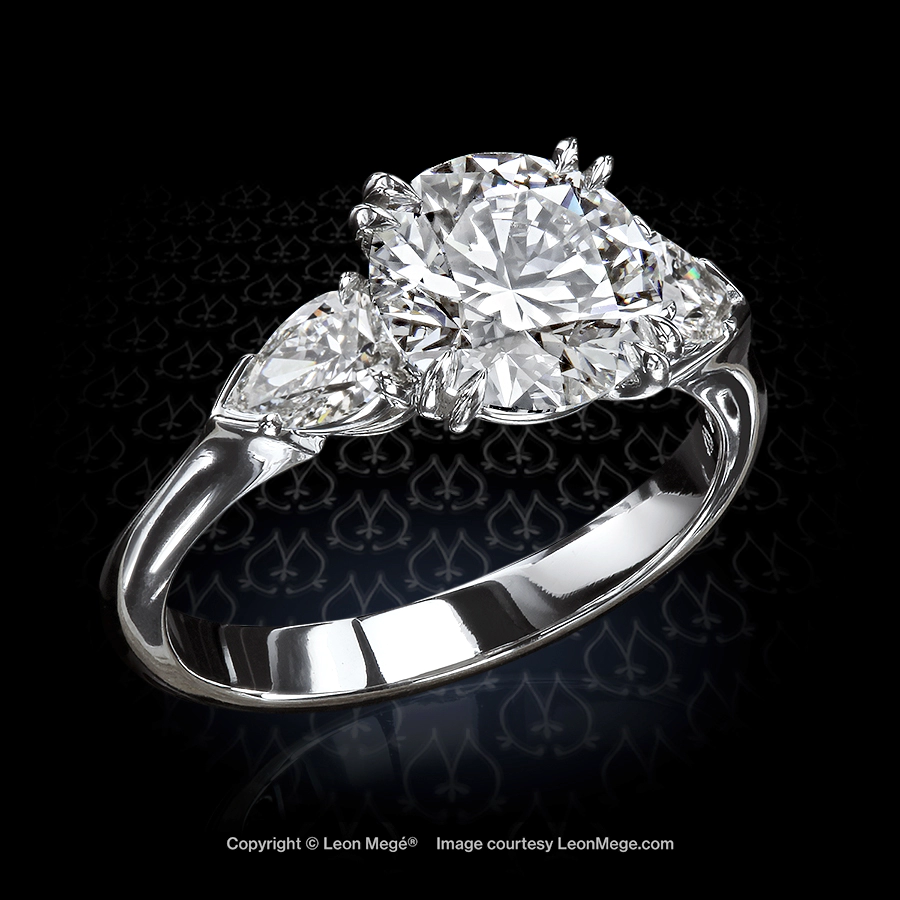 Leon Mege classical eternal trinity style three-stone ring with a round diamond and two pear-shape side stones