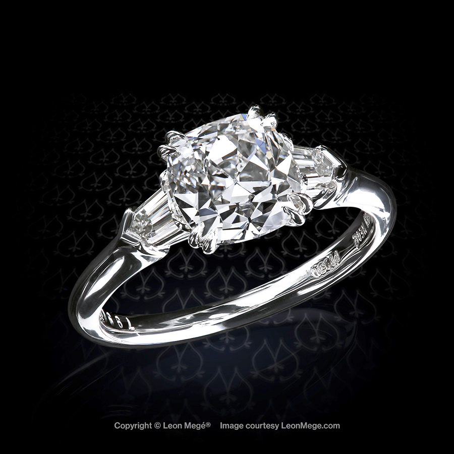 Leon Mege classic three-stone platinum ring with a majestic True Antique cushion diamond flanked with diamond bullet r7990